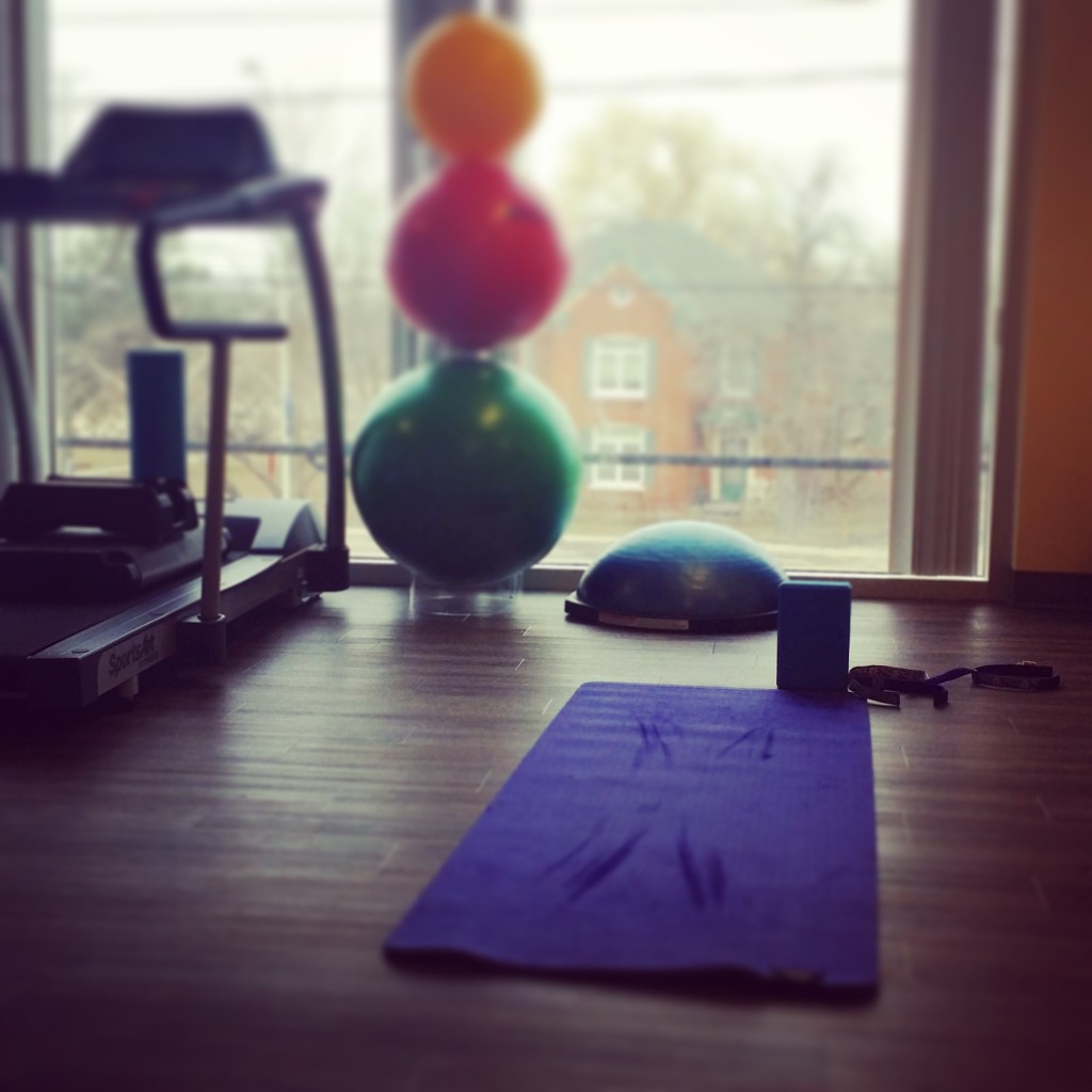 Yoga mat and exercise equipment looking out at Dundas and Bronte from our oakville Physio, massage and foot clinic