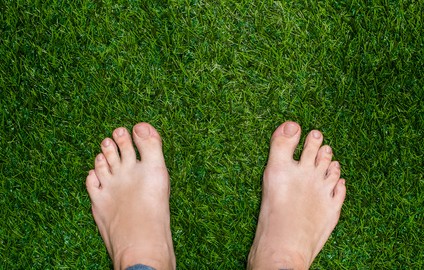 Feet on grass showing oakville footcare and diabetic footclinic
