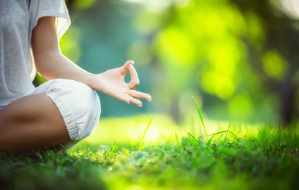 Meditating in nature, relaxation and stress-management strategies at Oakville Physiotherapy Clinic.