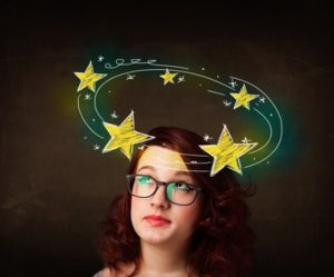 Girl with stars around head showing physio treatment in oakville for dizziness
