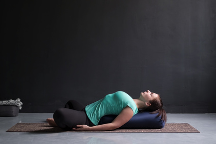 Restorative yoga pose showing yoga at oakville physiotherapy clinic