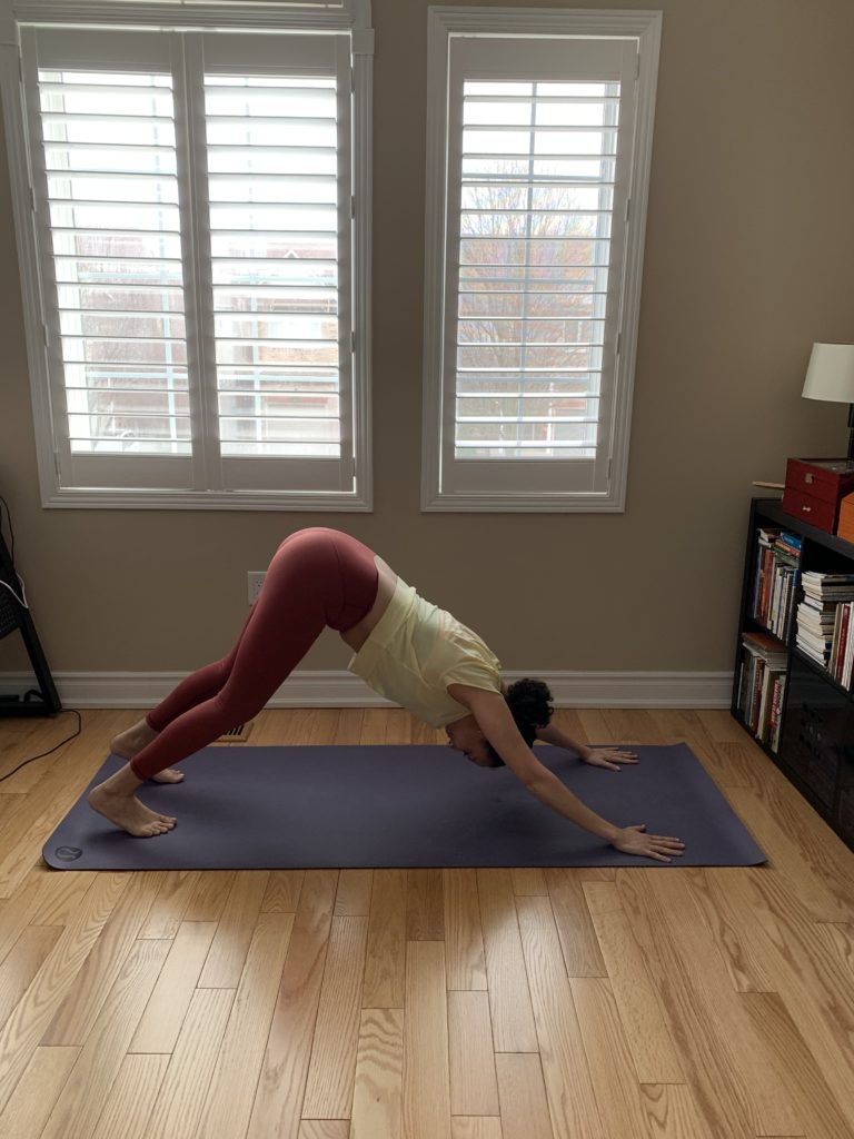 Burlington Physio showing downward facing dog yoga pose.