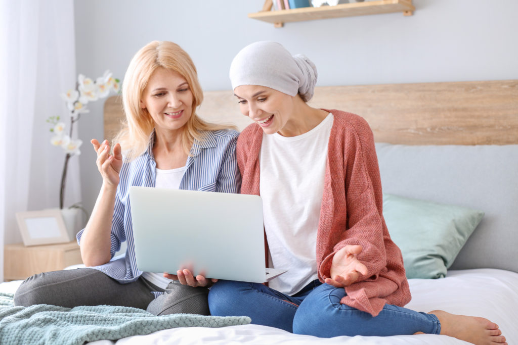 woman sitting with her mother having virtual physiotherapy in oakville, Ontario after chemo, mastectomy in Georgetown, Toronto, Milton, Ancaster, niagara, Guelph, Waterloo