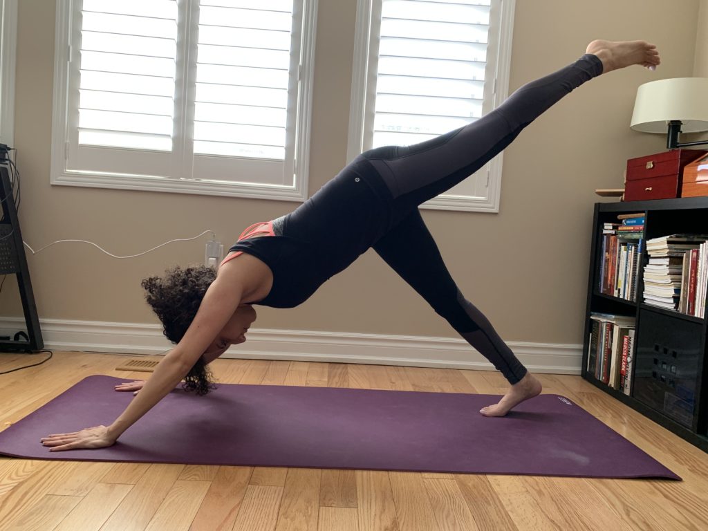 Burlington physio showing a three-legged downward facing dog yoga pose