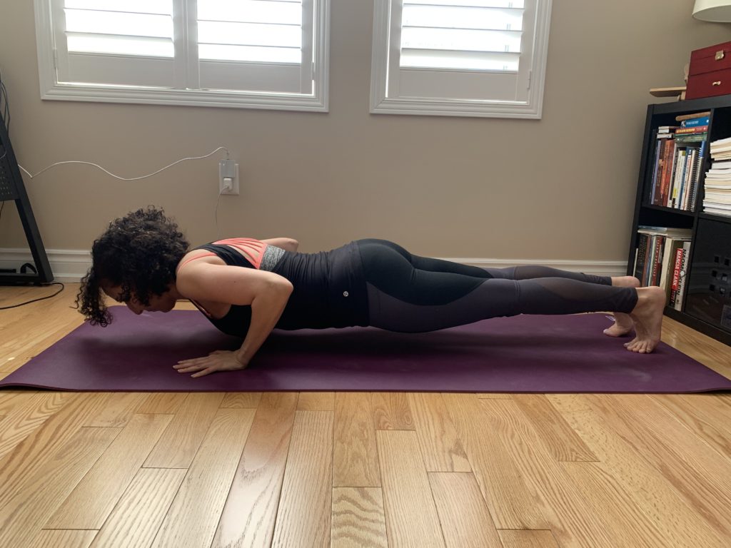 Oakville physio showing chaturanga, or four-limbed staff yoga pose for core strength.