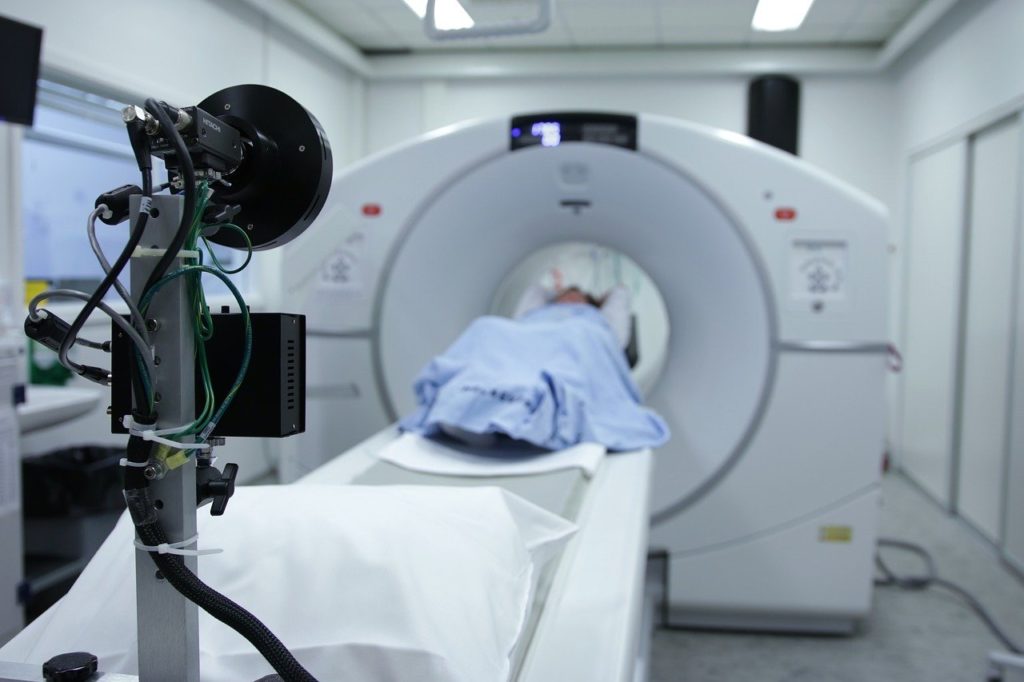 CT scan machine depicted in blog discussing different types of imaging, when imaging should be used, and when it does more harm than good.